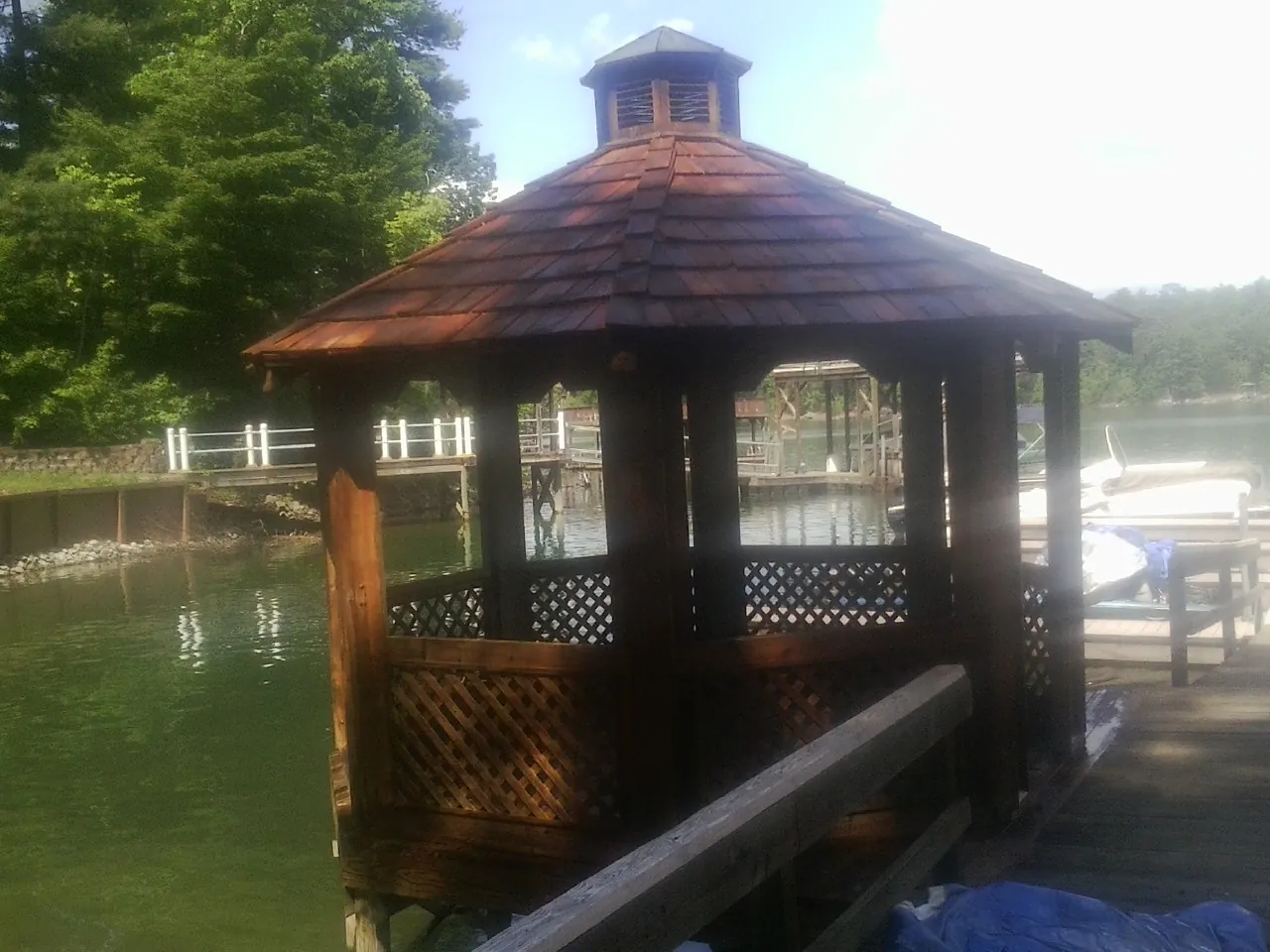 Cedar shake gazebo roof rebuilt on a lake dock in Mount Carmel